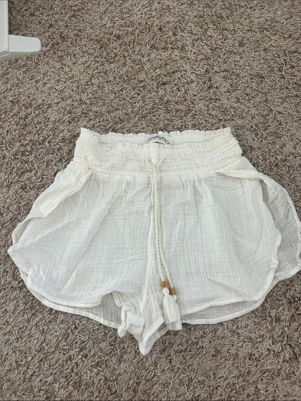 Abercrombie Women's White Smocked Waist Shorts with Tassel Tie